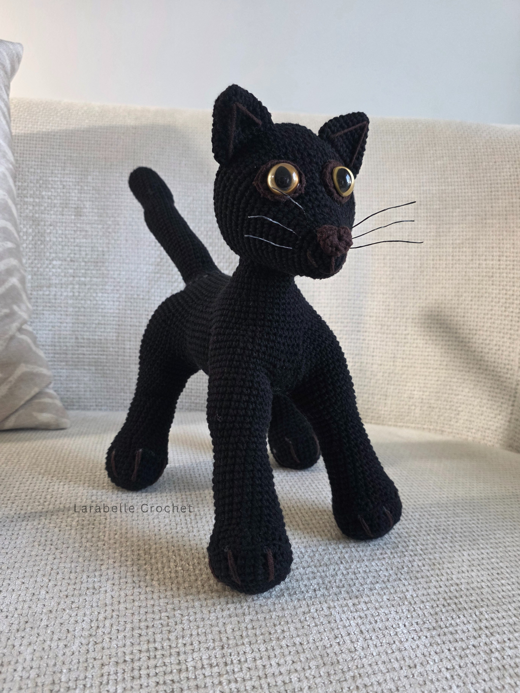 Front view of black cat crochet amigurumi