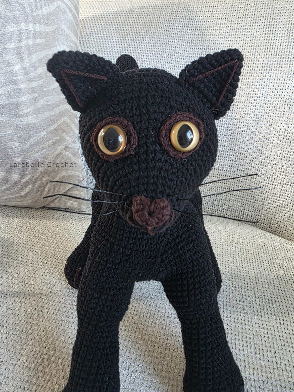 Front view and close up of black cat crochet amigurumi 