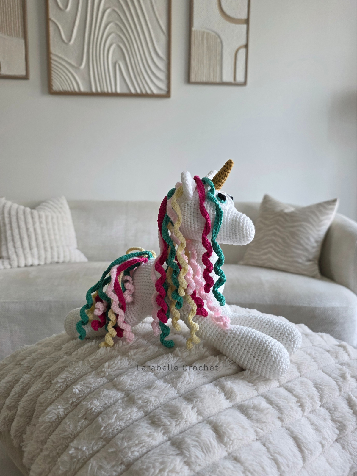 Side view of white unform crochet amigurumi laying down