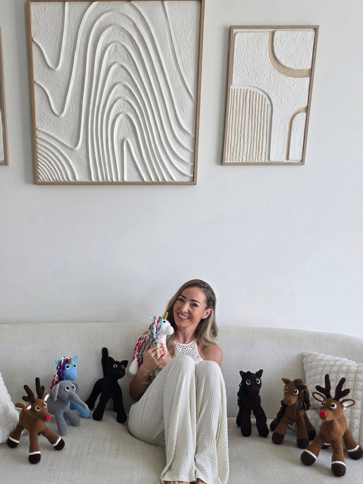 Shop owner creator with amigurumi crochet unicorn